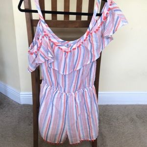 Romper. Blue and orange with orange tassels.